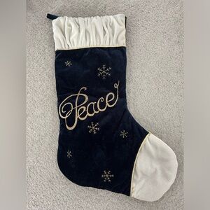 Blue and white stocking with the word "Peace"